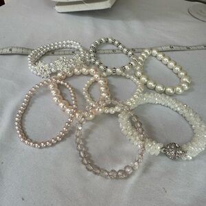 Seven stretch pearlized and sparkly bead bracelets